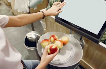 Integrated self checkout gates for supermarkets, Self-checkout gates with integrated anti-shoplifting technologies at a supermarket.