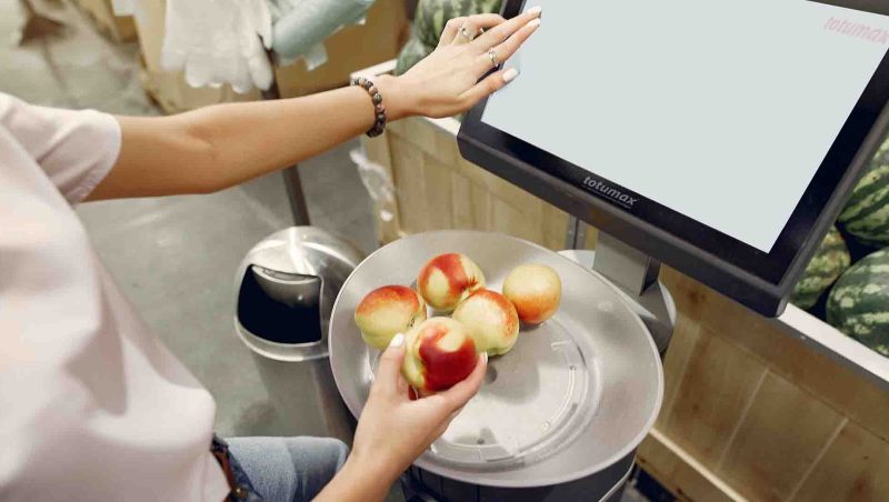 Integrated self checkout gates for supermarkets, Self-checkout gates with integrated anti-shoplifting technologies at a supermarket.